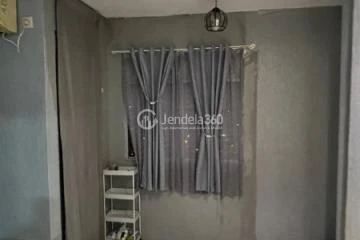 Bedroom Homey 1BR Apartment at Paragon Village Apartment Tower B