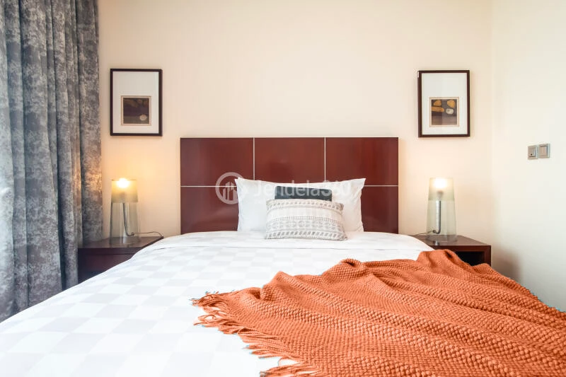 Bedroom 2 3BR Apartment with City View at Shangri-La Residence