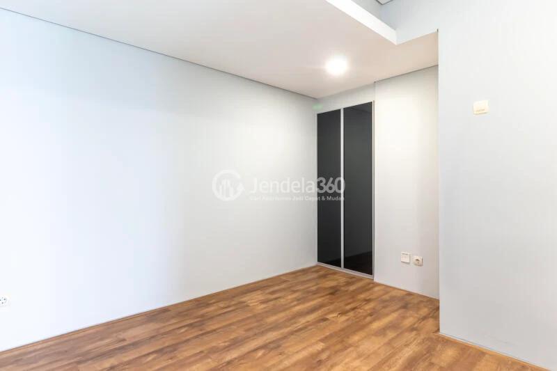 Bedroom 2 Restful 2BR Apartment Middle Floor with City View at Maqna Residence