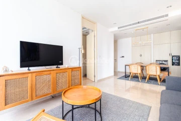 Living Room Flawless 2BR Apartment Middle Floor with Toll Road View at Izzara Apartment