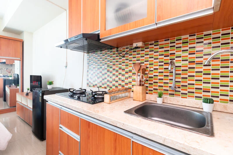 Kitchen Relaxed Studio Apartment at Grand Kamala Lagoon Apartment High Floor