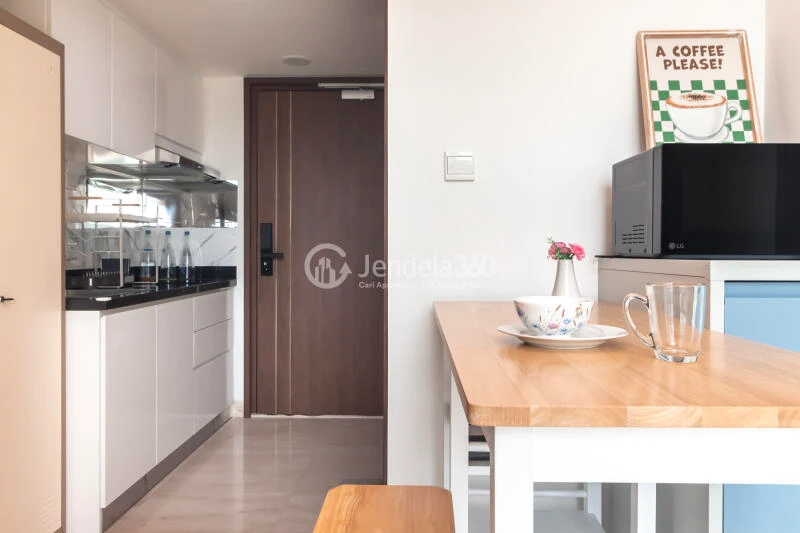 Living Room Studio Apartment with City View at Southgate Residence