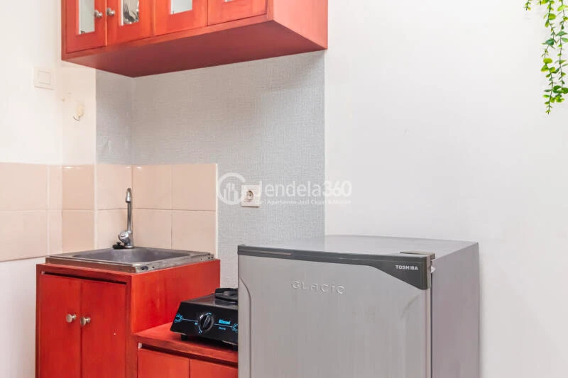 Kitchen Peaceful Studio Apartment High Floor with City View at Tifolia Apartment