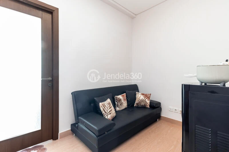 Living Room Peaceful 1BR Apartment at Puri Orchard Apartment Low Floor