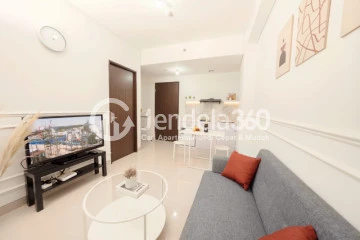 Living Room High Floor 2BR Apartment with City View at Transpark Cibubur Apartment
