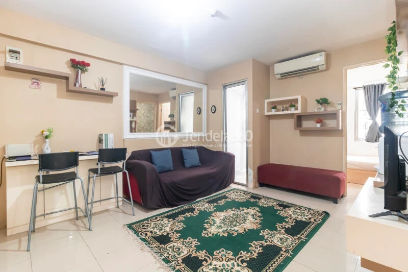 Living Room Peaceful 3BR Apartment at Bassura City Apartment Tower Geranium