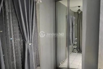 Bedroom Homey 1BR Apartment at Paragon Village Apartment Tower B