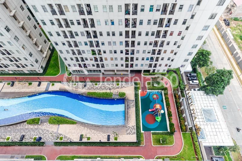 Balcony Cozy 2BR Apartment Middle Floor with City View at Kota Ayodhya Apartment