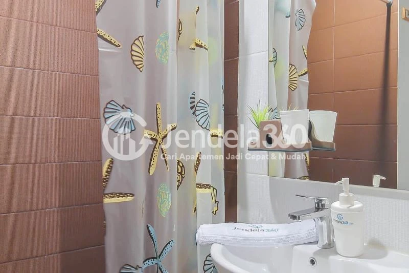 Bathroom Restful Stduio Apartment with City View from The Top Floor at Puri Orchard Apartment