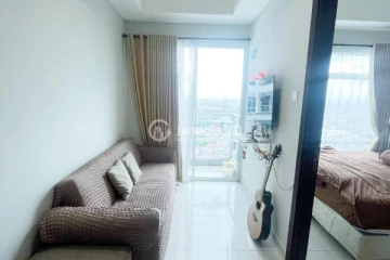 Living Room High Floor 1BR Apartment with City View at Puri Mansion
