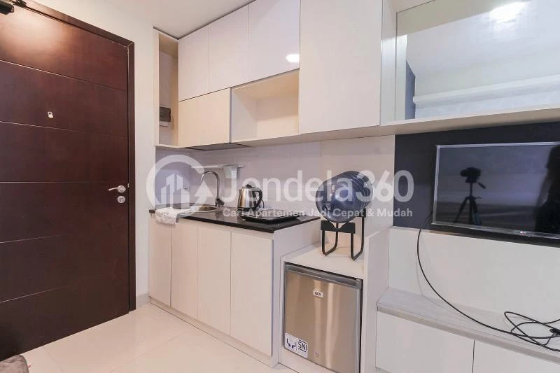 Kitchen Cozy Studio Apartment with Direct Access to Universitas Indonesia Train Station at Taman Melati Margonda Apartment