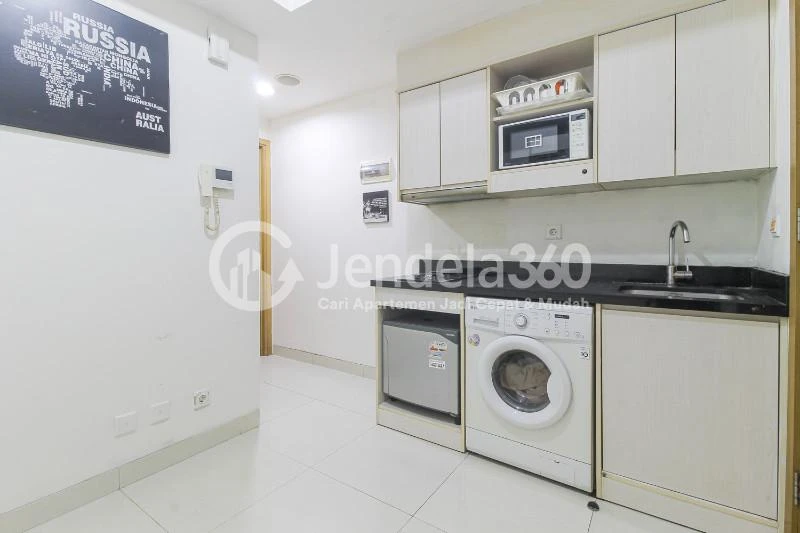 Kitchen Middle Floor 1BR Apartment with Golf view View at The Mansion Kemayoran Bougenville