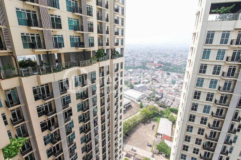 Balcony Modest Studio Apartment with City View from Heights at Puri Orchard Apartment