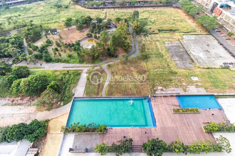 Balcony Fancy Studio Apartment Middle Floor with City View at Vasanta Innopark Apartment