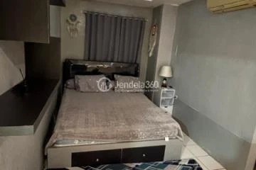 Bedroom Homey 1BR Apartment at Paragon Village Apartment Tower B