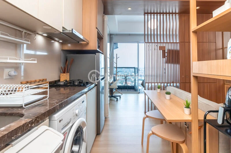 Kitchen Affordable 1BR Apartment High Floor with city View at Puri Mansion