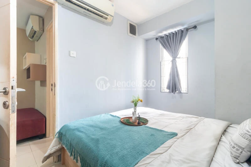 Bedroom 1 Peaceful 3BR Apartment at Bassura City Apartment Tower Geranium