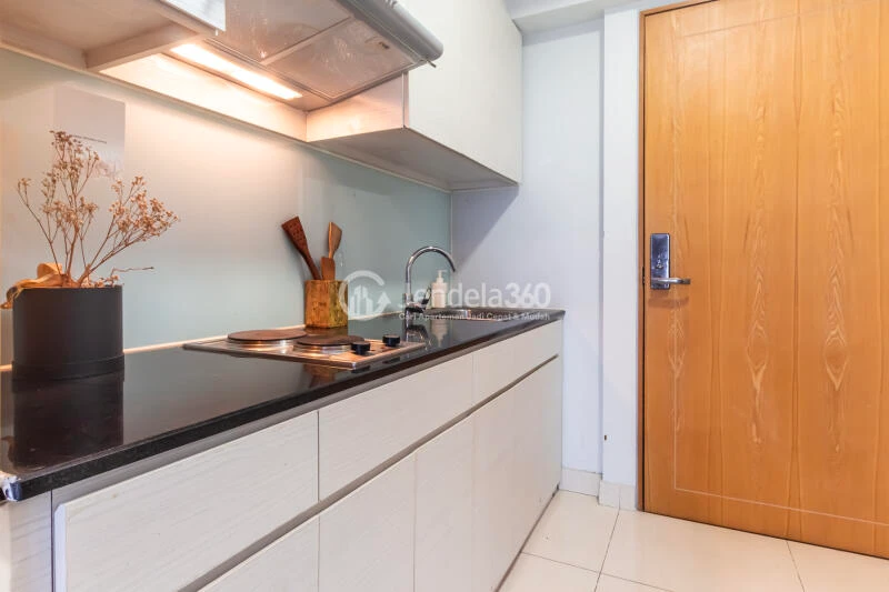 Kitchen Strategic Location 2BR Apartment Middle Floor with City View at Maqna Residence