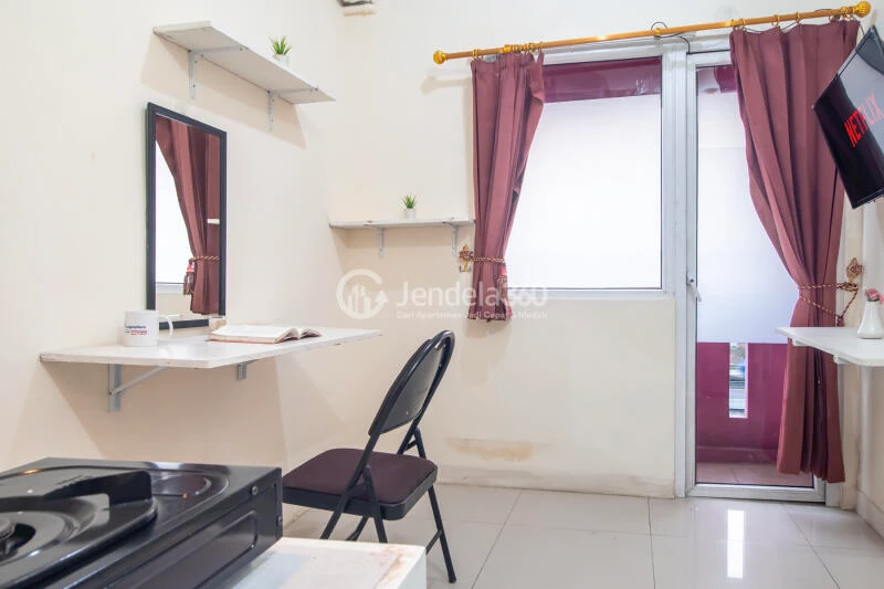 Living Room Low Floor 2BR Apartment with Swimming Pool View at Green Pramuka City Apartment