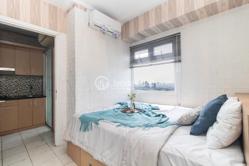 Bedroom 1 Relaxed 2BR Apartment Low Floor with  View at Green Pramuka City Apartment