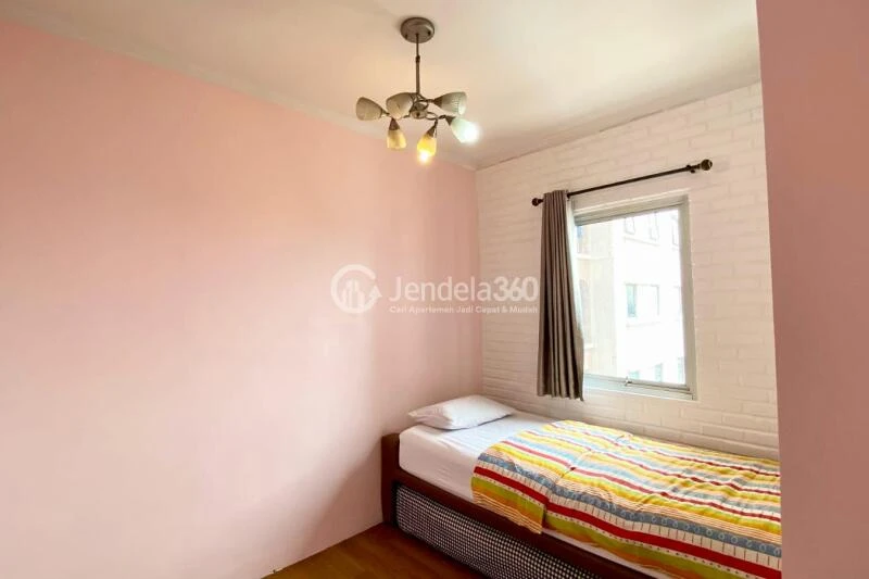 Bedroom 2 Affordable 3BR Apartment Middle Floor with Pool View at Gading Mediterania Residence