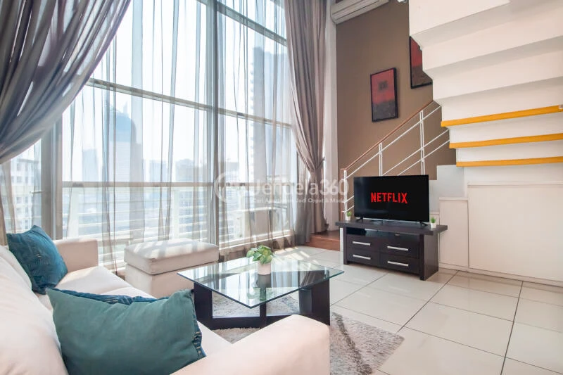 Living Room Stunning 1BR Apartment Middle Floor with City View at City Lofts Apartment