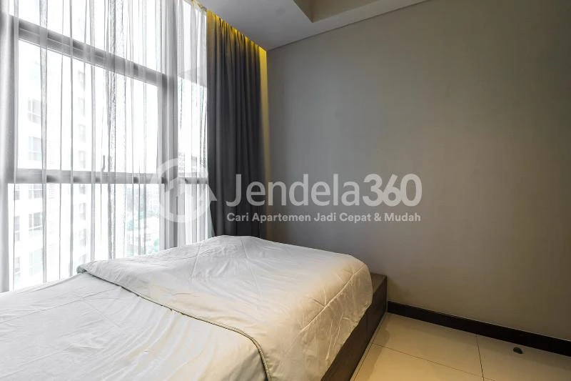 Bedroom 2 Restful 2BR Low Floor Apartment at Casa Grande Apartment