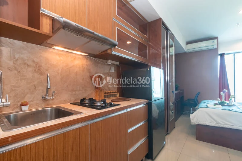 Kitchen Good Deal Studio Apartment at Grand Kamala Lagoon Apartment Low Floor
