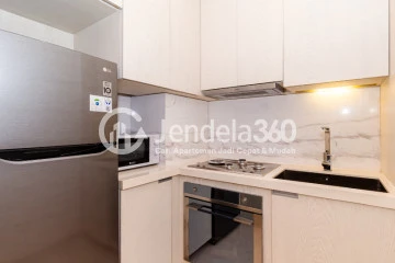 Kitchen Lovely 1BR Apartment at Izzara Apartment Middle Floor