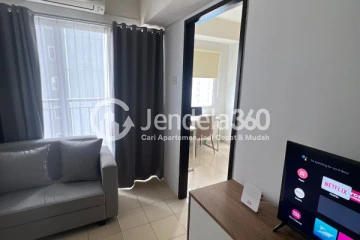 Living Room 1BR Apartment with Swimming Pool View at Serpong Green View Apartment