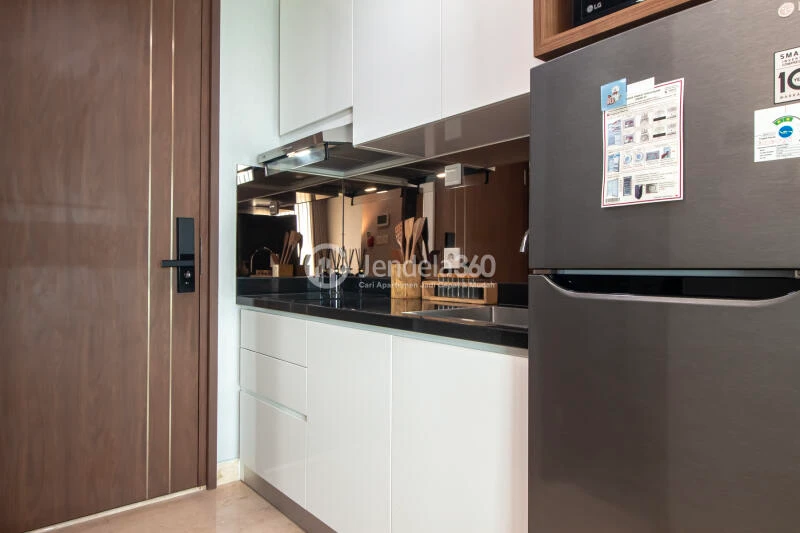 Kitchen Spacious Studio Apartment Near Universitas Pancasila at Southgate Residence