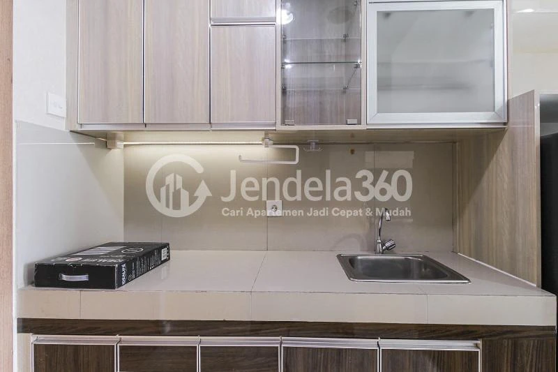 Kitchen Modest Studio Apartment with City View from Heights at Puri Orchard Apartment