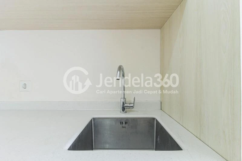 Kitchen Furnished Studio Apartment with City View at Sedayu City Apartment