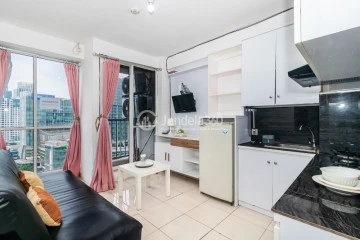 Living Room 2BR Apartment with City View at Tifolia Apartment