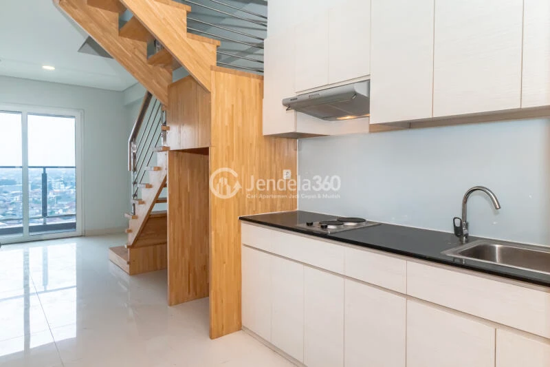Kitchen Restful 2BR Apartment Middle Floor with City View at Maqna Residence