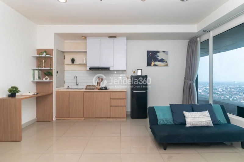Living Room Comfortable 2BR Apartment at Grand Kamala Lagoon Apartment Tower Emerald North