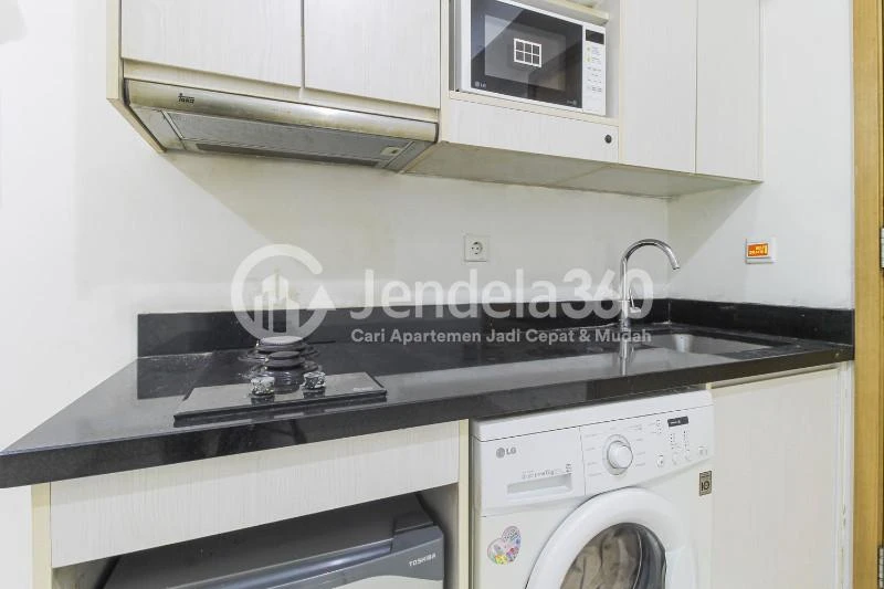 Kitchen Middle Floor 1BR Apartment with Golf view View at The Mansion Kemayoran Bougenville