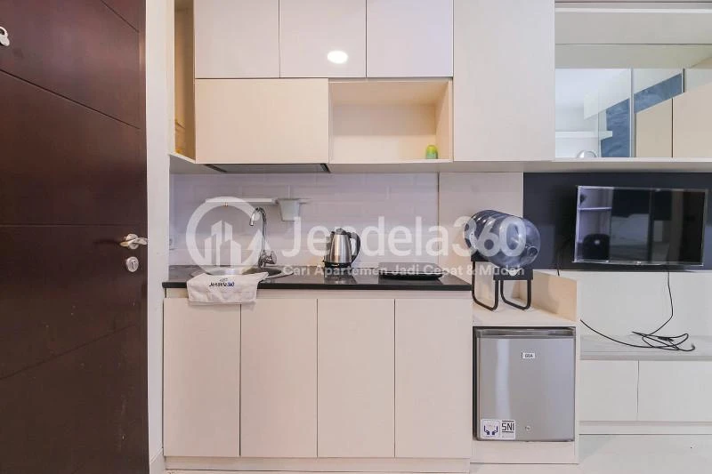 Kitchen Cozy Studio Apartment with Direct Access to Universitas Indonesia Train Station at Taman Melati Margonda Apartment