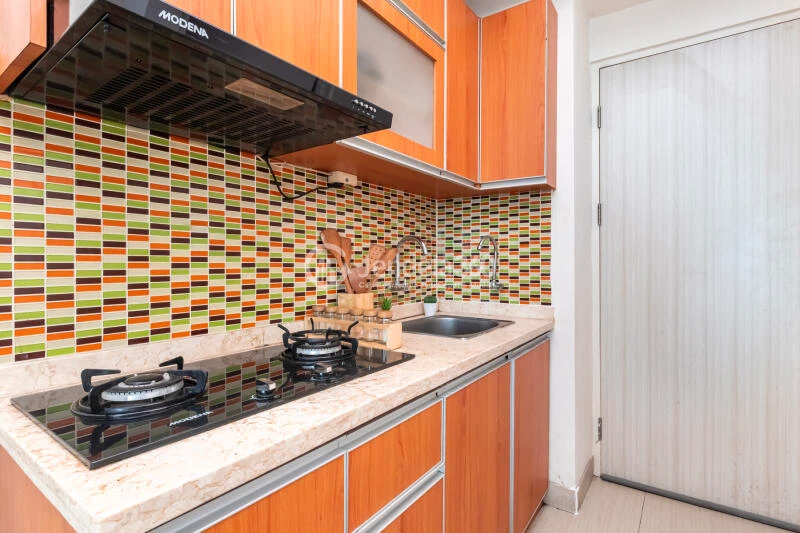 Kitchen Relaxed Studio Apartment at Grand Kamala Lagoon Apartment High Floor