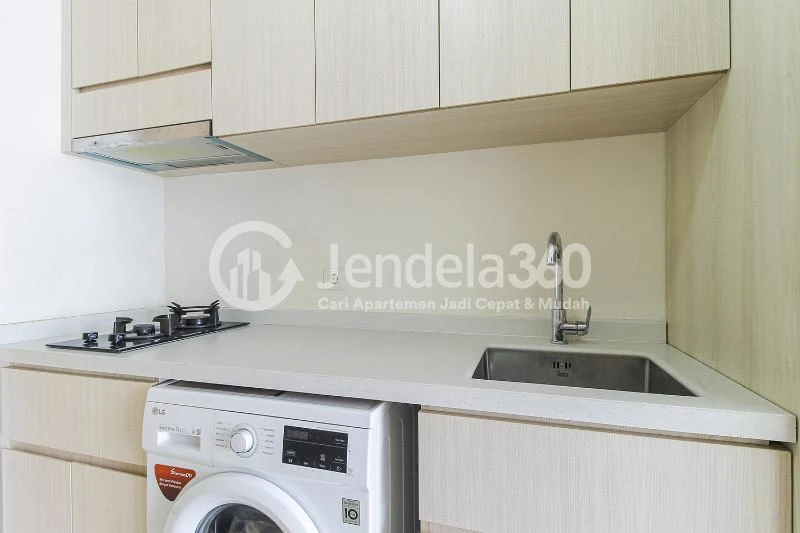 Kitchen Furnished Studio Apartment with City View at Sedayu City Apartment