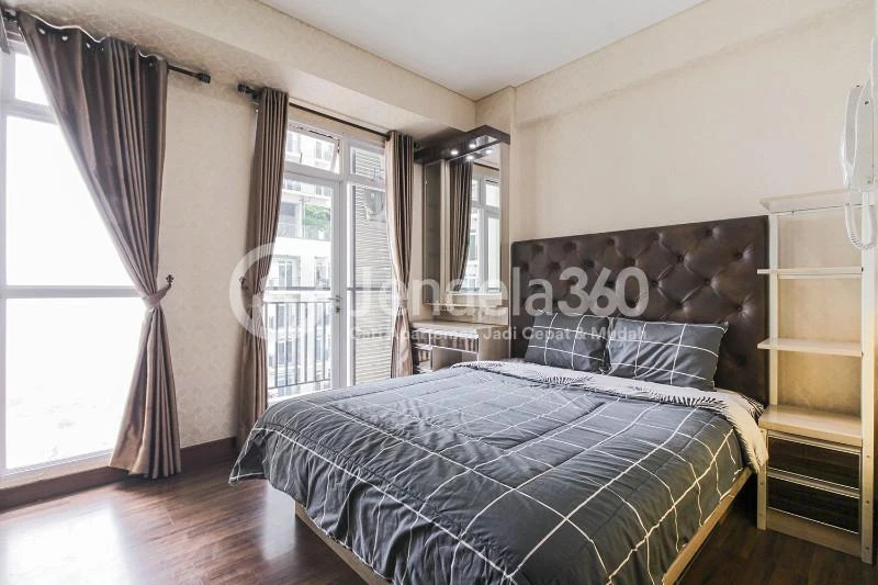 Bedroom Modest Studio Apartment with City View from Heights at Puri Orchard Apartment