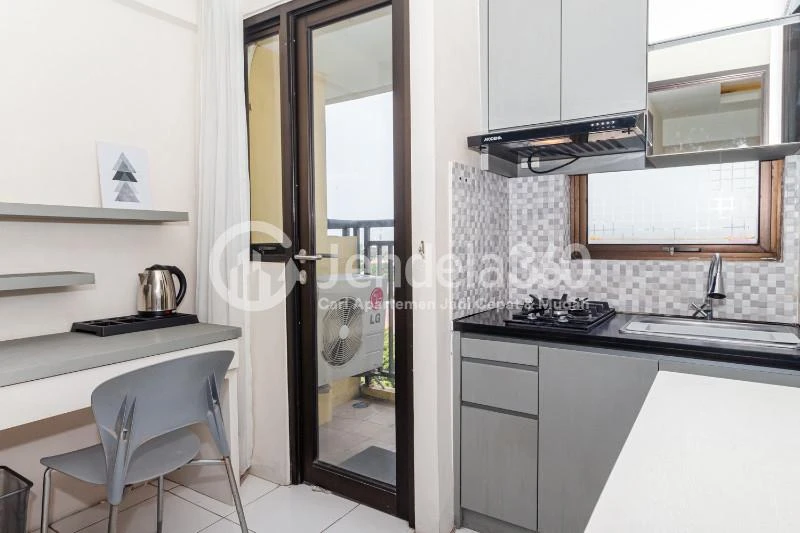 Kitchen Restful 1BR Apartment at Kebagusan City Apartment Low Floor