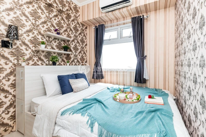 Bedroom 1 High Floor 2BR Apartment with City View at Green Pramuka City Apartment