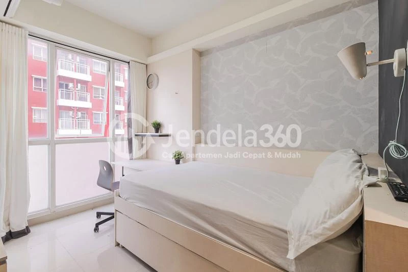 Bedroom Cozy Studio Apartment with Direct Access to Universitas Indonesia Train Station at Taman Melati Margonda Apartment