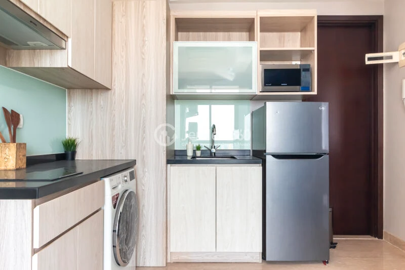Kitchen High Floor 2BR Apartment with City View at Menteng Park