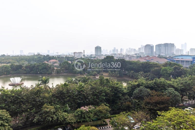 Balcony Low Floor Studio Apartment with City View at Kalibata City Green Palace