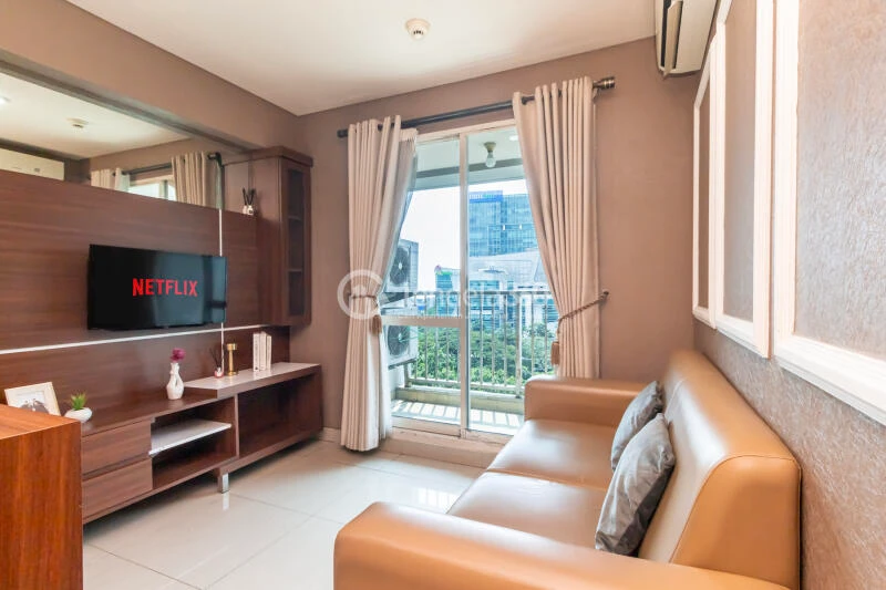 Living Room Low Floor 1BR Apartment with City View at Callia Apartment