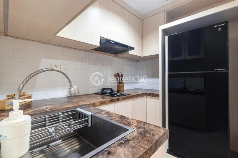 Kitchen 1BR Apartment with City View at Vasanta Innopark Apartment