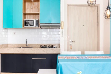 Kitchen 2BR Apartment with Swimming Pool View at Elpis Residence Apartment