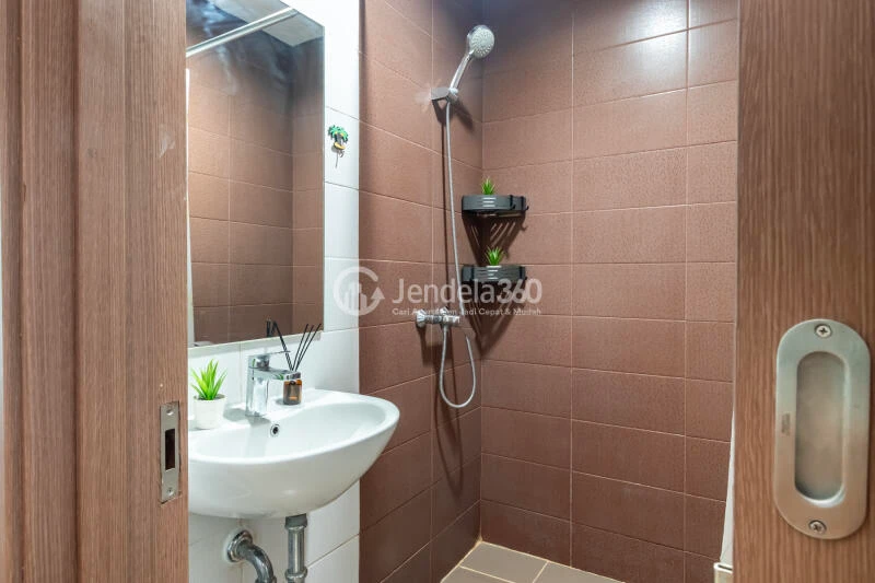 Bathroom Peaceful 1BR Apartment at Puri Orchard Apartment Low Floor